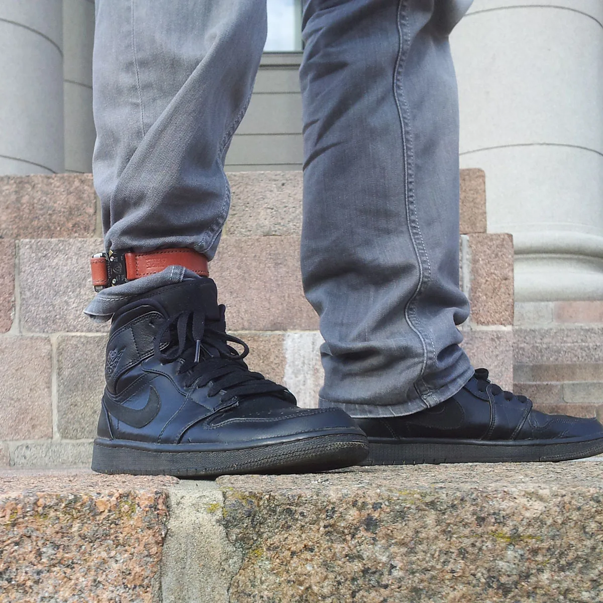 Leather trouser band worn by cyclist for city commuting