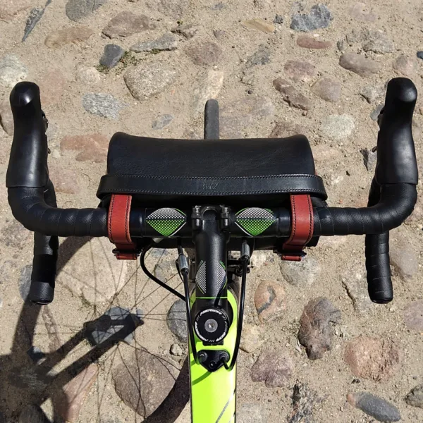 Bike with handlebar bag riding over city cobblestones