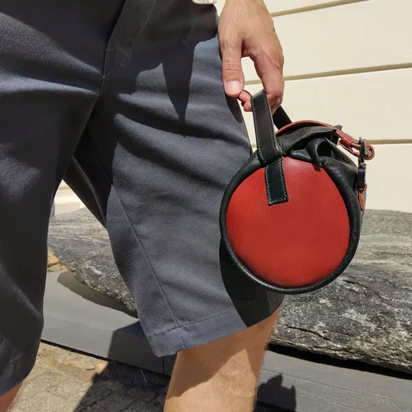 City cyclist holding premium leather handlebar bag