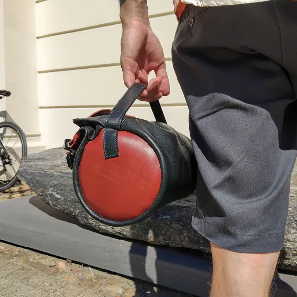 High-end handlebar bike bag held in hand