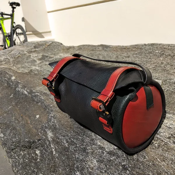 Leather handlebar bag placed in urban city setting