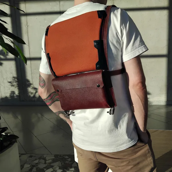 Urban cycling vest with rear pocket worn by city cyclist